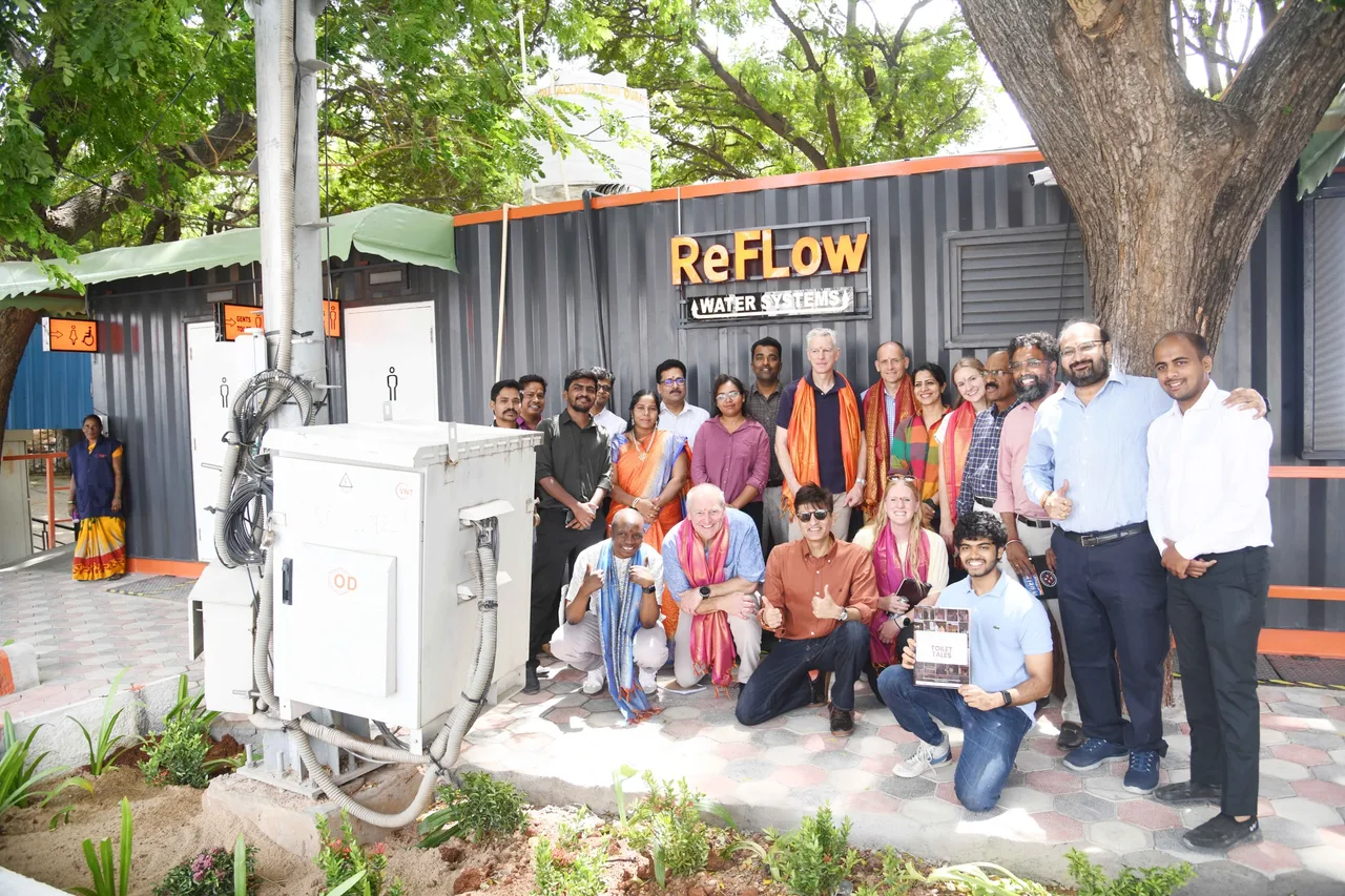 A group beside the ReFlow facility, July 2026